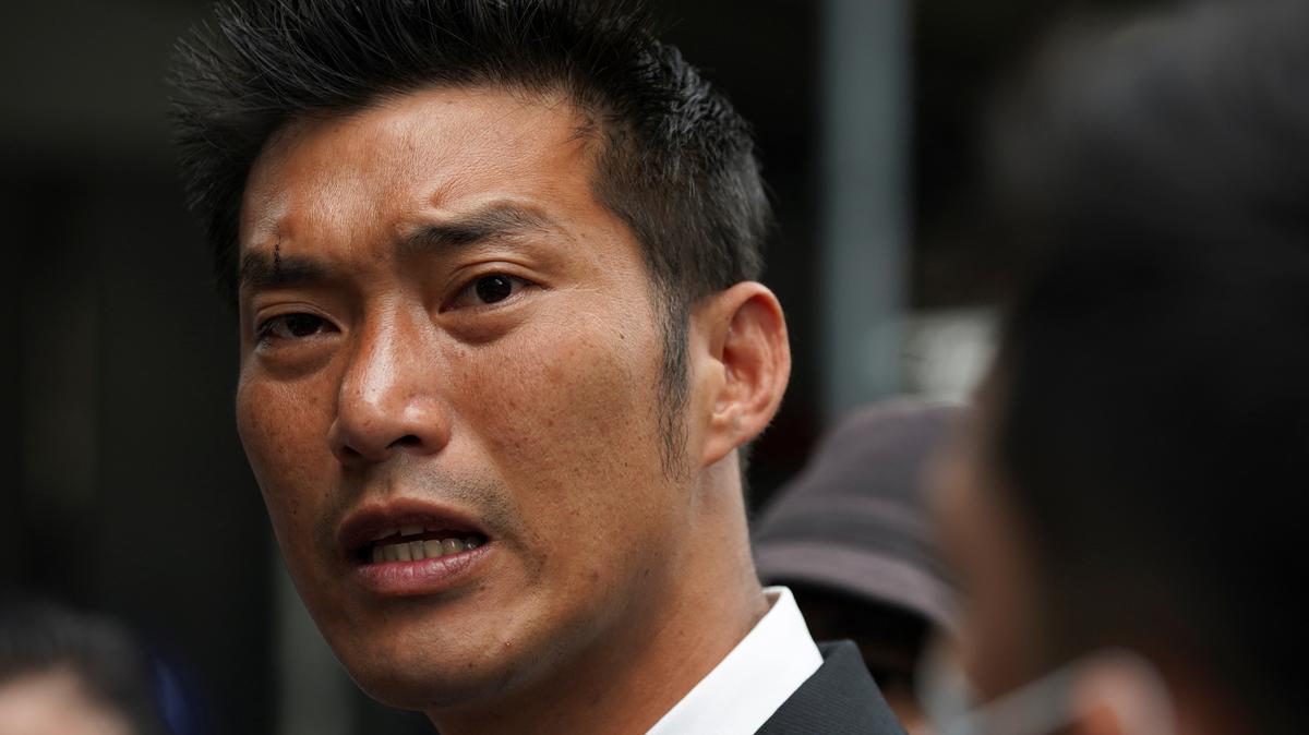 Banned opposition politician Thanathorn Juangroongruangkit turns up at a police station after police charged him with defaming the monarchy, after he accused the government of relying too much on a royal-owned company to produce its supply of coronavirus vaccines, in Bangkok, Thailand, March 30, 2021. REUTERS/Athit Perawongmetha