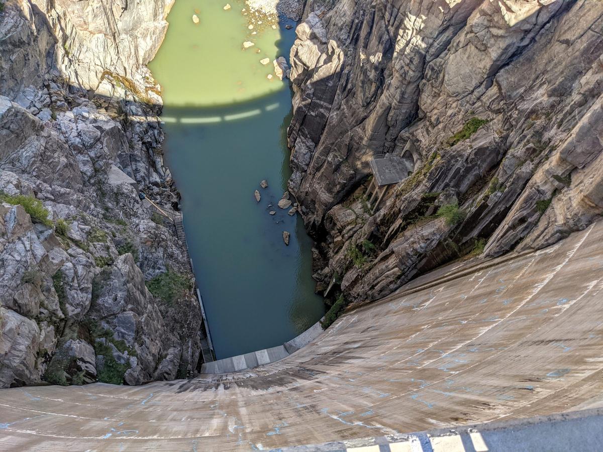  You can walk out and look straight down 350 feet from the top of the Buffalo Bill Dam to the Shoshone River below. Photo credit: Cindy Richards. 