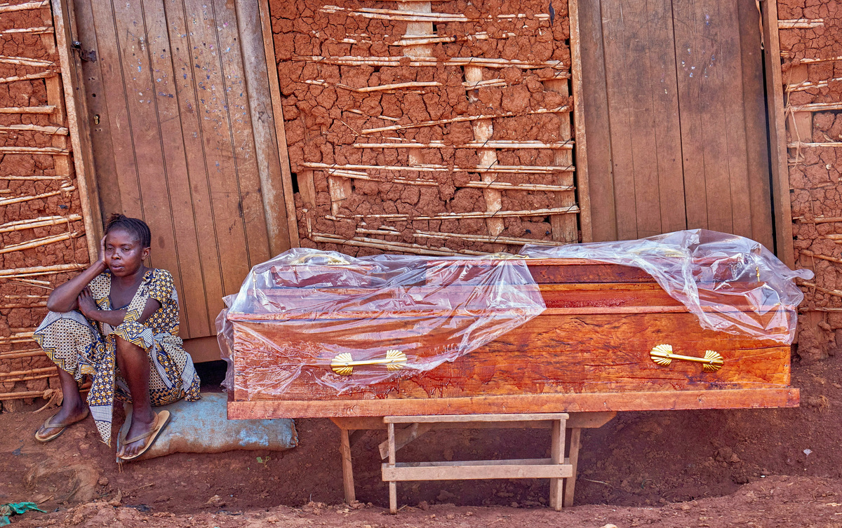 FILE PHOTO: A Congolese woman reacts outside the house of a man, who died of Ebola, as she waits for medical workers to retrieve his body, as aid agencies intensify efforts to contain a new Ebola outbreak involving the Bundibugyo strain, in Quartier Shuni 1, a residential sector in Mongbwalu, Djugu Territory of Ituri province, Democratic Republic of Congo, May 24, 2026. REUTERS/Gradel Muyisa Mumbere/File Photo
