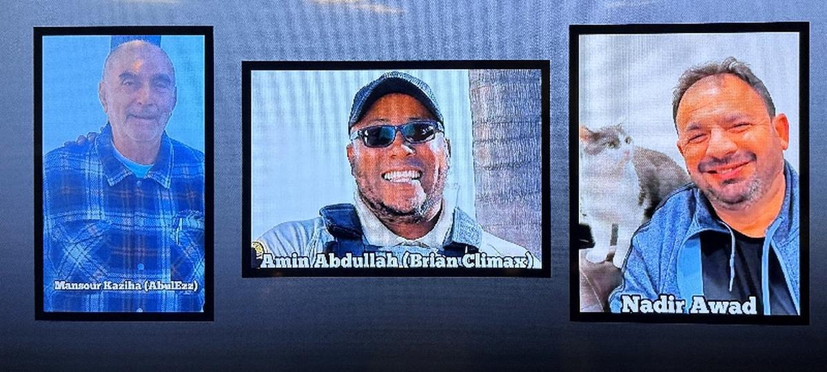 A video monitor shows images of Mansour Kaziha, security guard Amin Abdullah, also known to friends as Brian Climax and Nadir Awad, who were killed during a shooting attack at the Islamic Centre of San Diego, during a news conference at police headquarters in San Diego, California, U.S, May 19, 2026. REUTERS/Arafat Barbakh