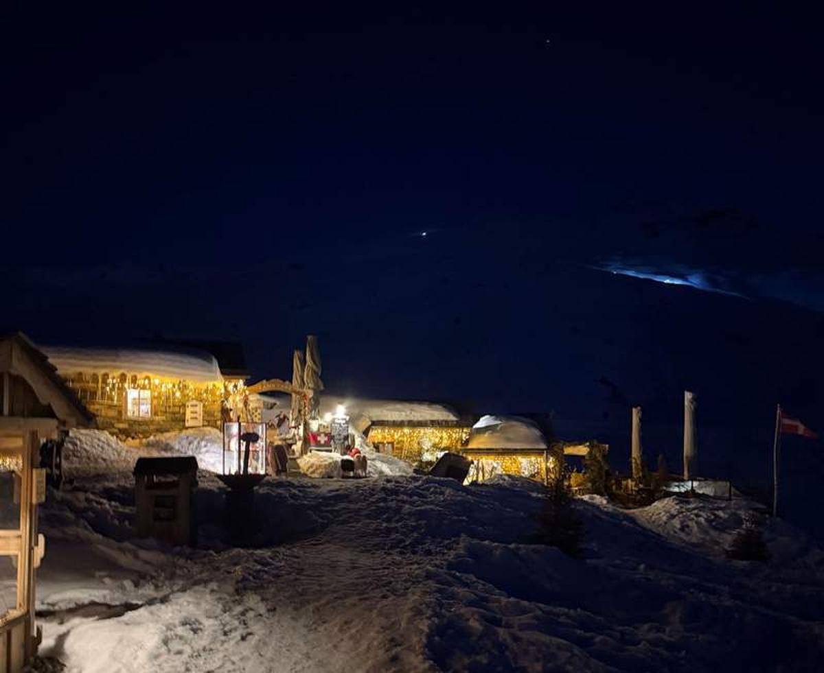  Chez Pepe Nicolas at night in Val Thorens - warm lights, deep snow, and the kind of mountain atmosphere that makes you want to stay for one more fondue. Photo credit: Liana Moore 