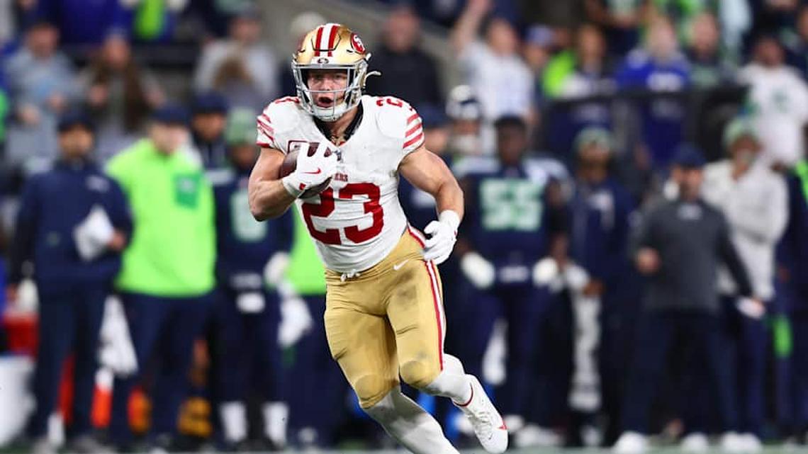  Jan 17, 2026; Seattle, WA, USA; San Francisco 49ers running back Christian McCaffrey (23) runs after the catch against the Seattle Seahawks during the first half in an NFC Divisional Round game at Lumen Field. Mandatory Credit: Kevin Ng-Imagn Images | Kevin Ng-Imagn Images 