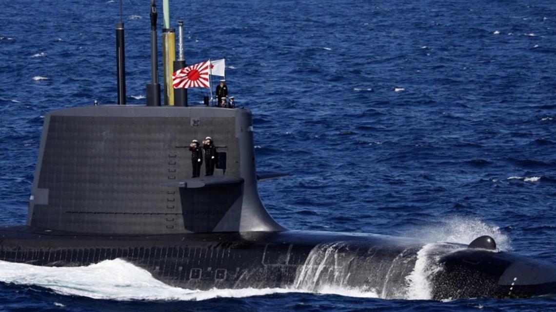 Japan ruling party backs broader weapons exports