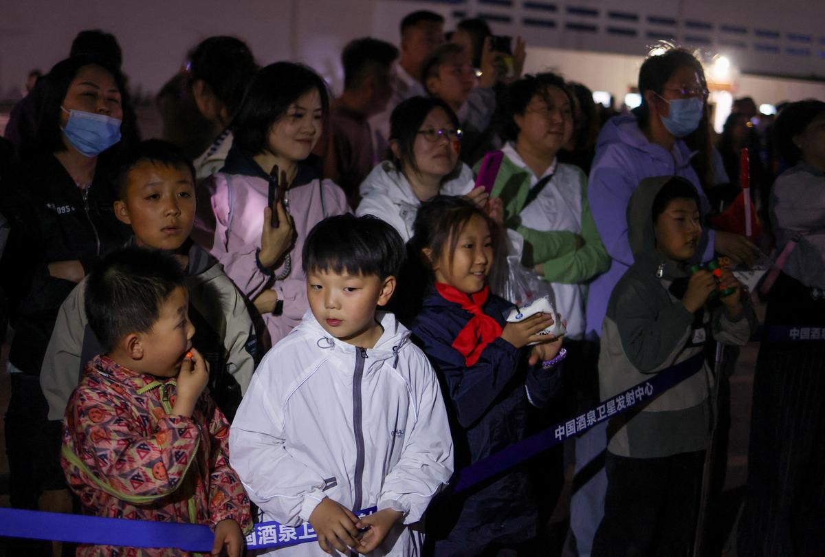 People gather ahead of the Shenzhou-23 spaceflight mission to China's Tiangong space station, at the Jiuquan Satellite Launch Center, near Jiuquan, Gansu province, China, May 24, 2026. REUTERS/Maxim Shemetov