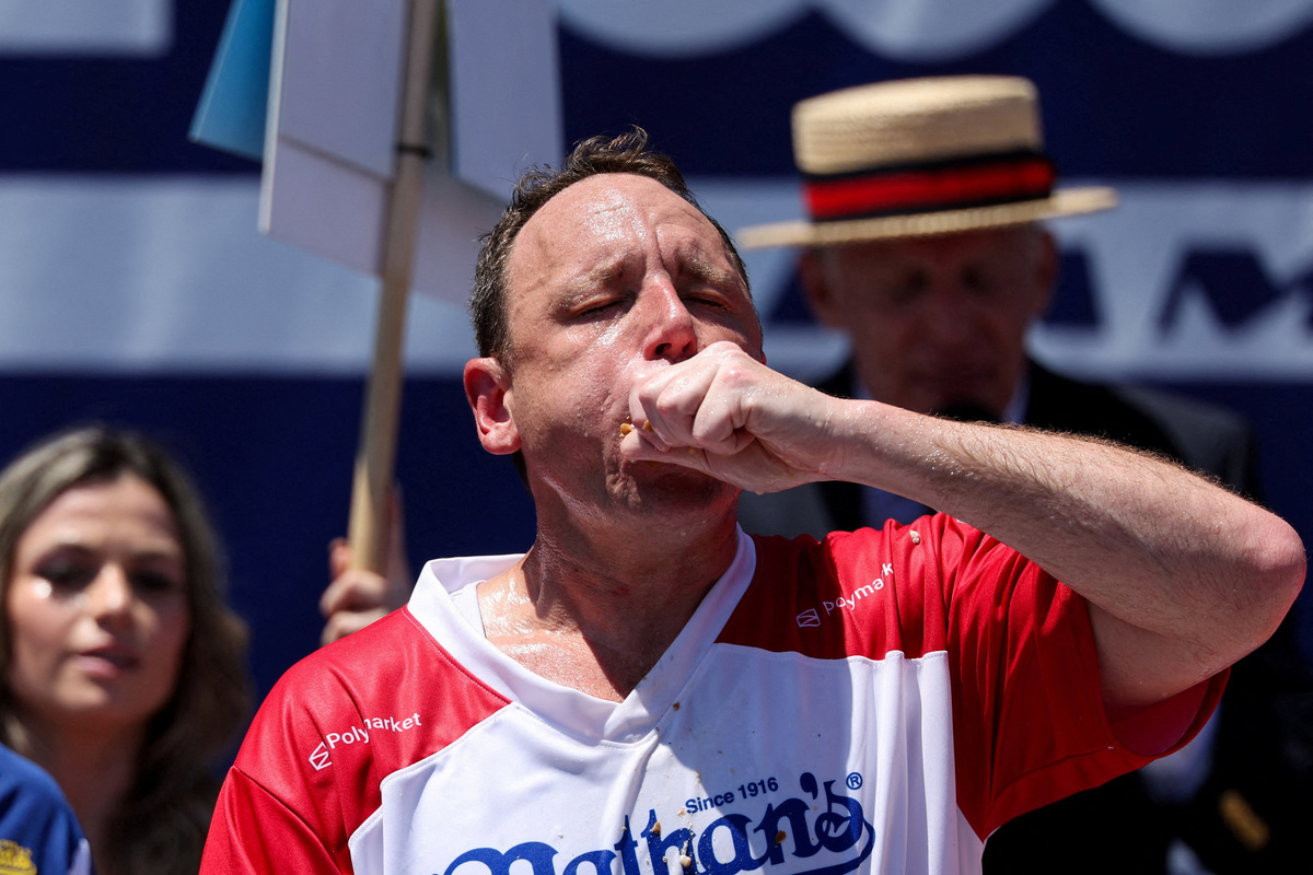 Joey Chestnut participates in the 2026 Nathan's Famous International Hot Dog Eating Contest, at Coney Island, Brooklyn in New York City, U.S., July 4, 2026. REUTERS/Jordan Tovin