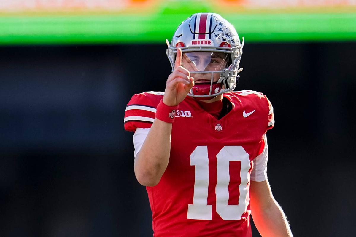  Ohio State Buckeyes quarterback Julian Sayin (10) motions for a first down during the NCAA football game against the Rutgers Scarlet Knights at Ohio Stadium in Columbus on Nov. 22, 2025. Ohio State won 42-9. 