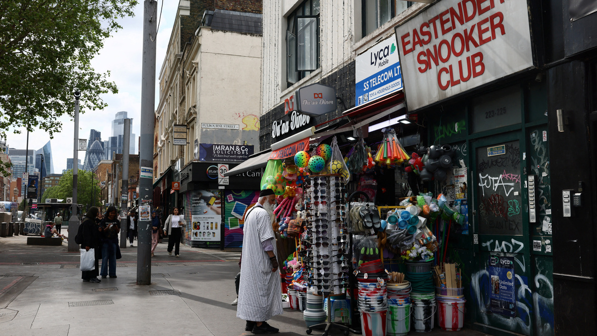 A man looks at sunglasses displayed outside a shop in Tower Hamlets, London, Britain, May 3, 2026. REUTERS/Jack Taylor