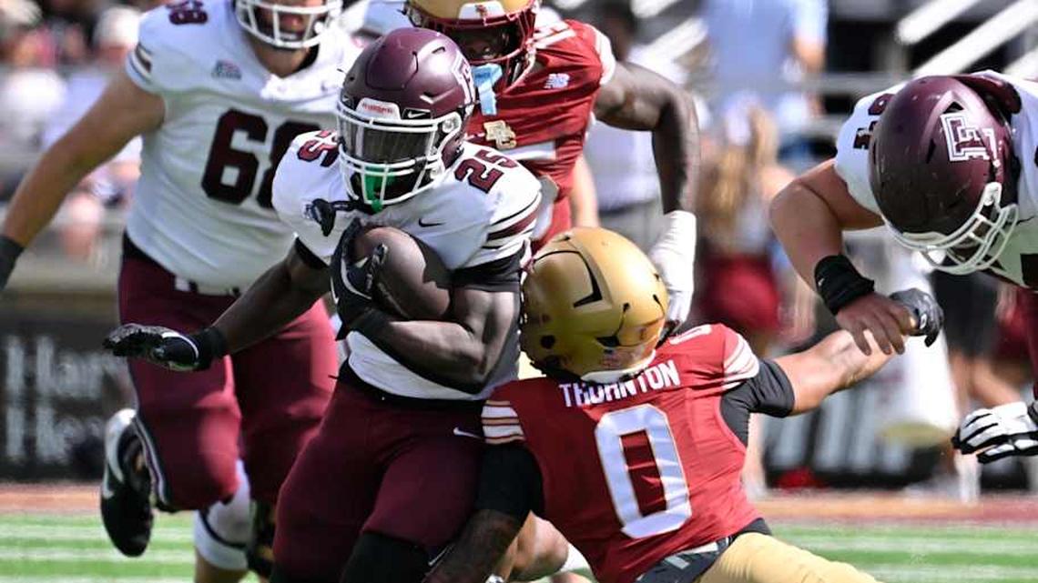 Aug 30, 2025; Chestnut Hill, Massachusetts, USA; Fordham Rams running back Jamell James (25) runs the ball against Boston College Eagles defensive back Omar Thornton (0) during the first half at Alumni Stadium. Mandatory Credit: Eric Canha-Imagn Images | Eric Canha-Imagn Images 