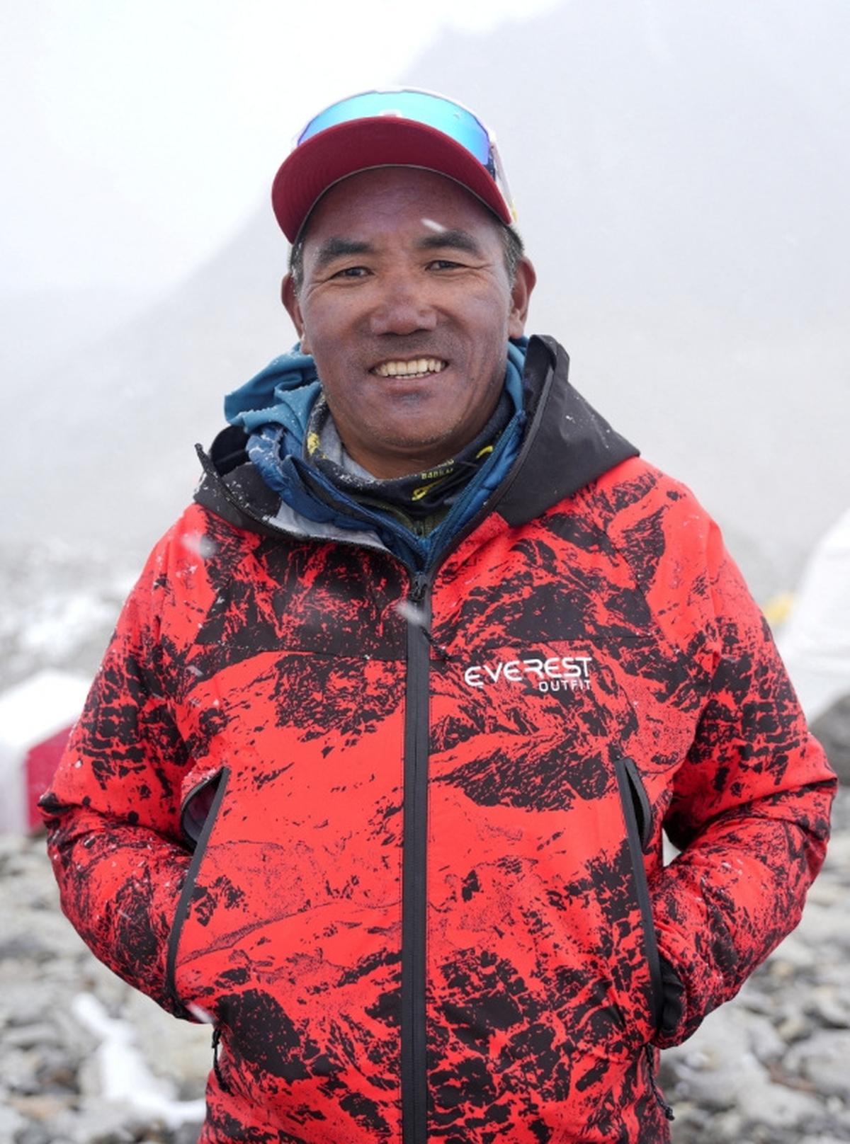 FILE PHOTO: Kami Rita Sherpa, 56, a Nepali mountaineer who has climbed Mount Everest 32 times and holds the record for reaching the summit of the world's highest mountain, smiles as he poses for a picture at Everest Base Camp  in the Solukhumbu district, also known as the Everest region, Nepal, April 29, 2026. REUTERS/Purnima Shrestha/File Photo