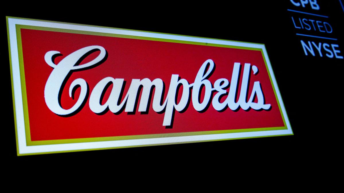 FILE PHOTO: The logo and ticker for Campbell Soup Co. are displayed on a screen on the floor of the New York Stock Exchange in New York, U.S., May 18, 2018. REUTERS/Brendan McDermid/File Photo