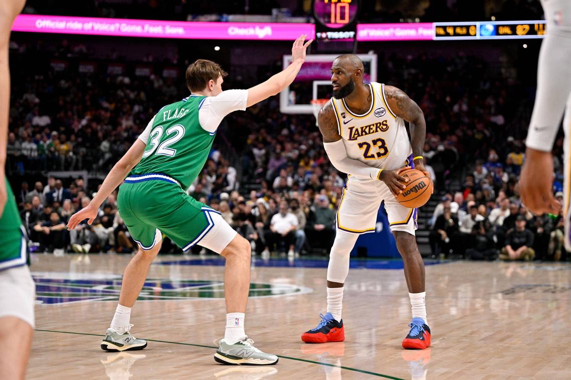  Los Angeles Lakers forward LeBron James (23) looks to move the ball past Dallas Mavericks forward Cooper Flagg (32) 