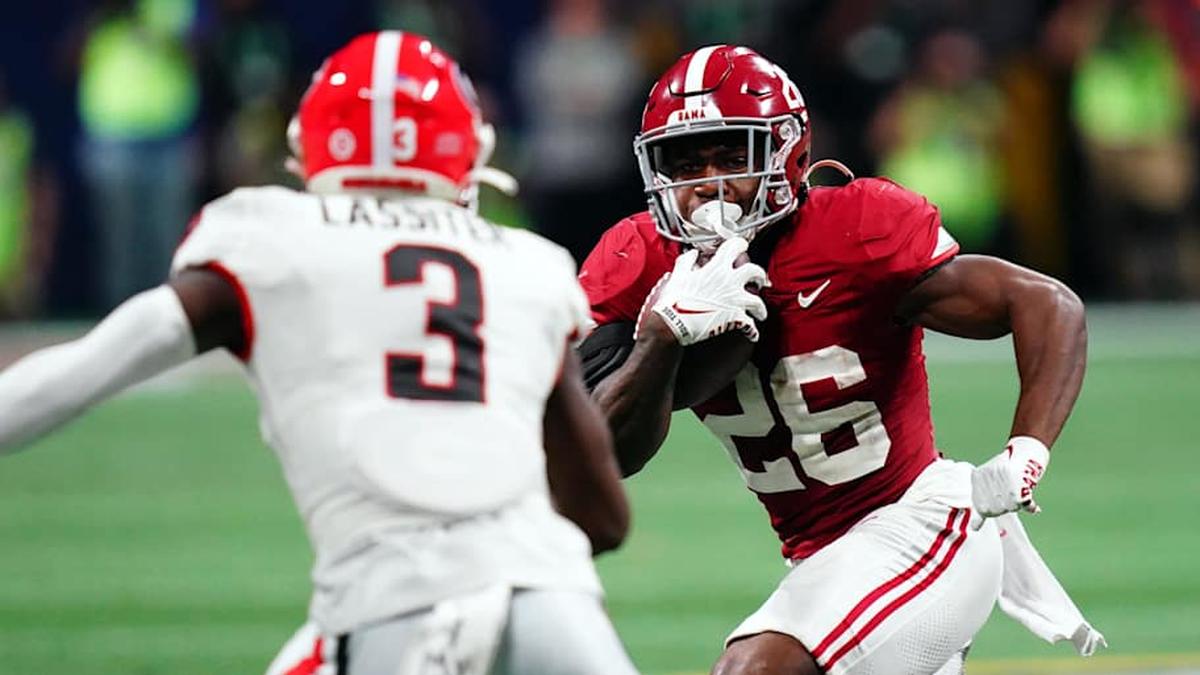  Dec 2, 2023; Atlanta, GA, USA; Alabama Crimson Tide running back Jam Miller (26) runs against Georgia Bulldogs defensive back Kamari Lassiter (3) in the fourth quarter of the SEC Championship at Mercedes-Benz Stadium. Mandatory Credit: John David Mercer-Imagn Images | John David Mercer-Imagn Images 