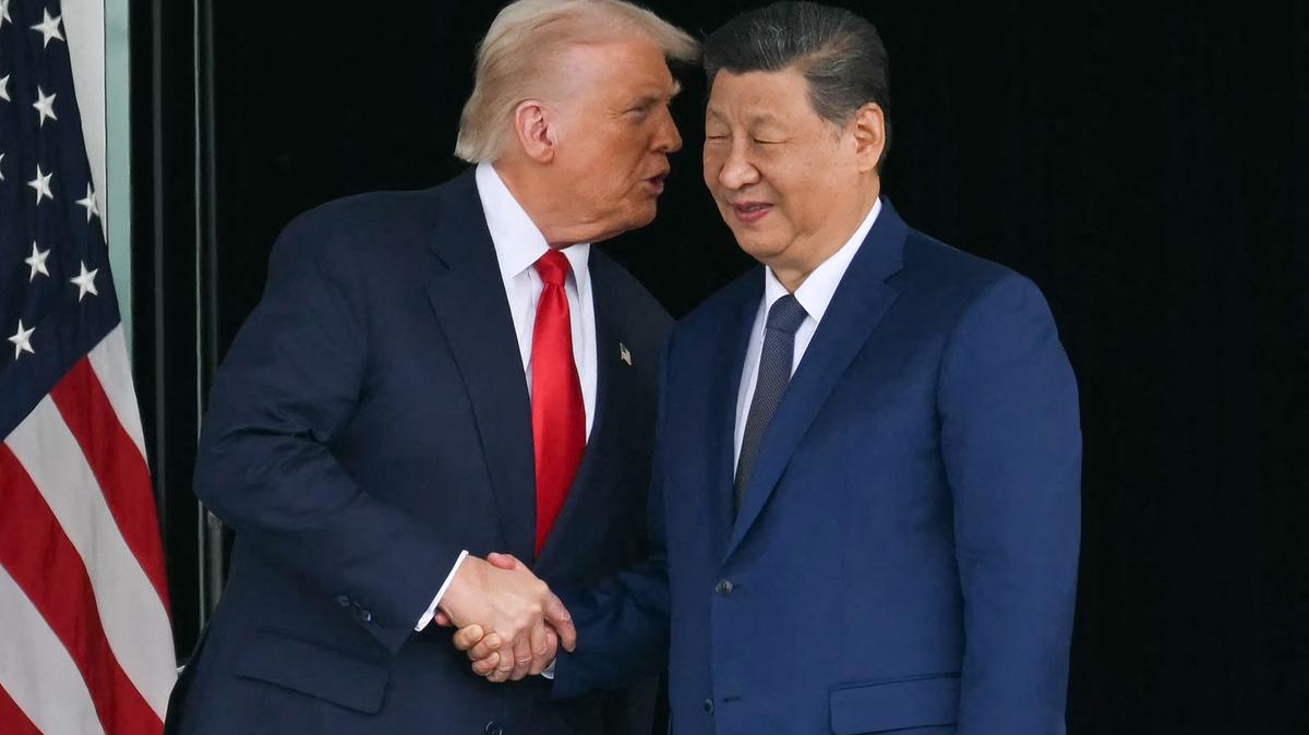 U,S, President Donald Trump, left, and China's President Xi Jinping shake hands as they leave after their talks at the Gimhae Air Base, located next to the Gimhae International Airport in Busan, on Oct. 30, 2025.