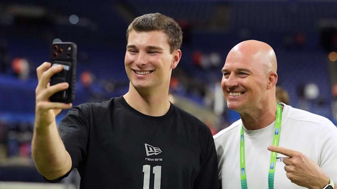  Feb 28, 2026; Indianapolis, IN, USA; Indiana quarterback Fernando Mendoza (QB11) poses with former Seattle Seahawks quarterback Matt Hasselbeck during the NFL Scouting Combine at Lucas Oil Stadium. Mandatory Credit: Kirby Lee-Imagn Images | Kirby Lee-Imagn Images 