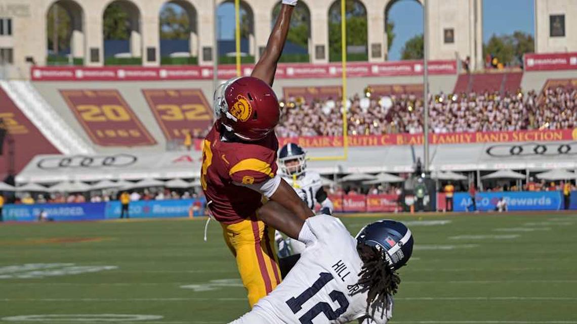  Sep 6, 2025; Los Angeles, California, USA; USC Trojans wide receiver Ja'Kobi Lane (8) makes a one handed catch for a touchdown as he is defended by Georgia Southern Eagles defensive back Tracy Hill Jr. (12) during the first quarter at United Airlines Field at Los Angeles Memorial Coliseum. Mandatory Credit: Jayne Kamin-Oncea-Imagn Images | Jayne Kamin-Oncea-Imagn Images 