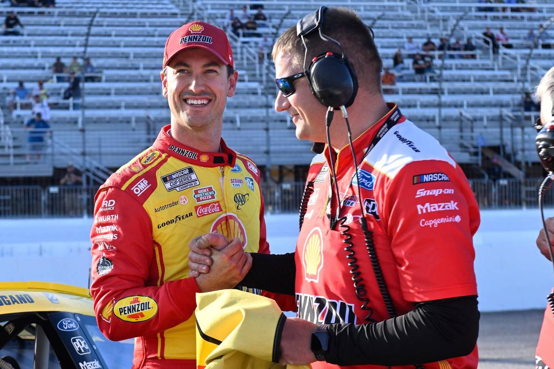  NASCAR Cup Series driver Joey Logano (22) celebrates winning the #1 pole position for the Mobil 1 301 with a member of his crew at New Hampshire Motor Speedway. Eric Canha-Imagn Images