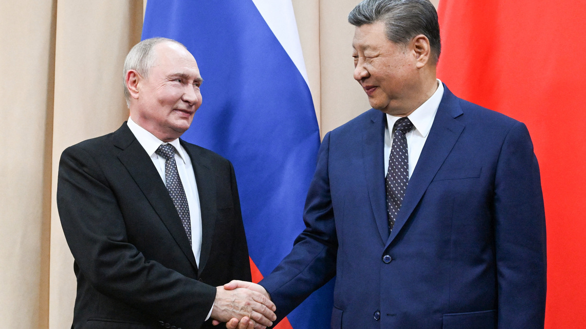 China's Xi tells Putin that foundations of ties will be stronger