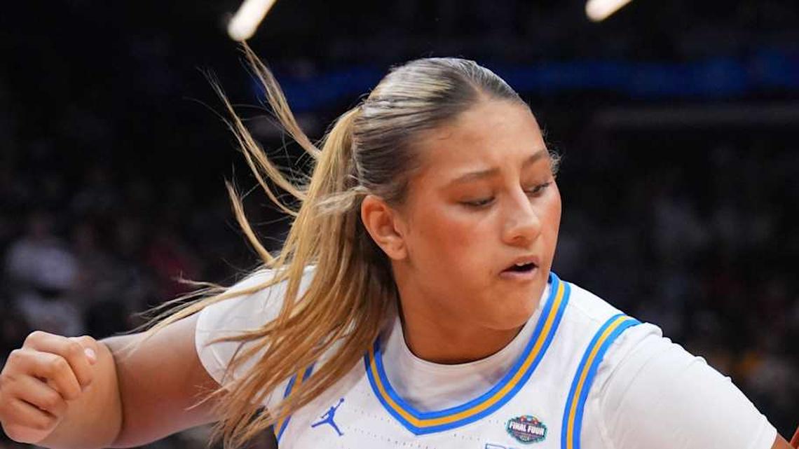  Apr 3, 2026; Phoenix, AZ, USA; UCLA Bruins forward Sienna Betts (16) defends against Texas Longhorns center Kyla Oldacre (00) during the second half of a semifinal of the Final Four of the women's 2026 NCAA Tournament at Mortgage Matchup Center. Mandatory Credit: Joe Camporeale-Imagn Images | Joe Camporeale-Imagn Images 