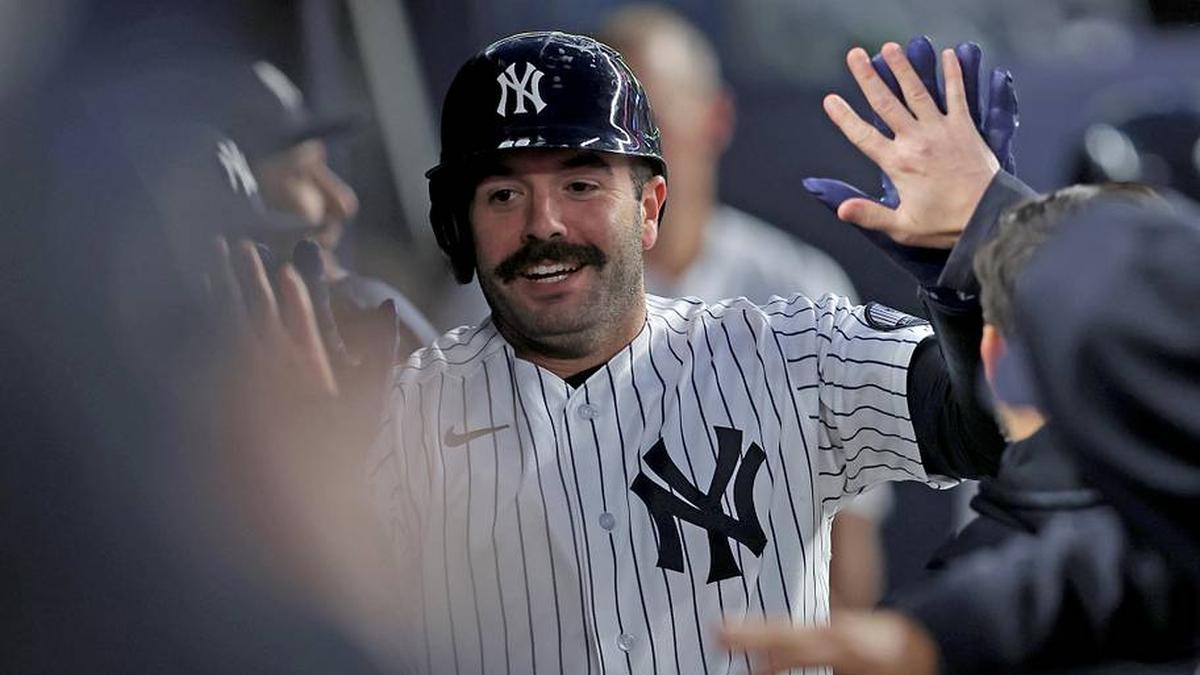  New York Yankees catcher Austin Wells (28) celebrates his solo home run against the Tampa Bay Rays in the dugout during the fifth inning at Yankee Stadium. | Brad Penner-Imagn Images 