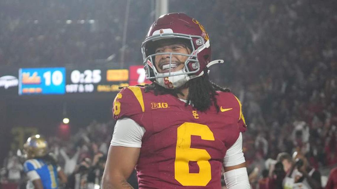  Nov 29, 2025; Los Angeles, California, USA; Southern California Trojans wide receiver Makai Lemon (6) celebrates after catching a 32-yard touchdown pass against the UCLA Bruins in the second half at United Airlines Field at Los Angeles Memorial Coliseum. Mandatory Credit: Kirby Lee-Imagn Images | Kirby Lee-Imagn Images 