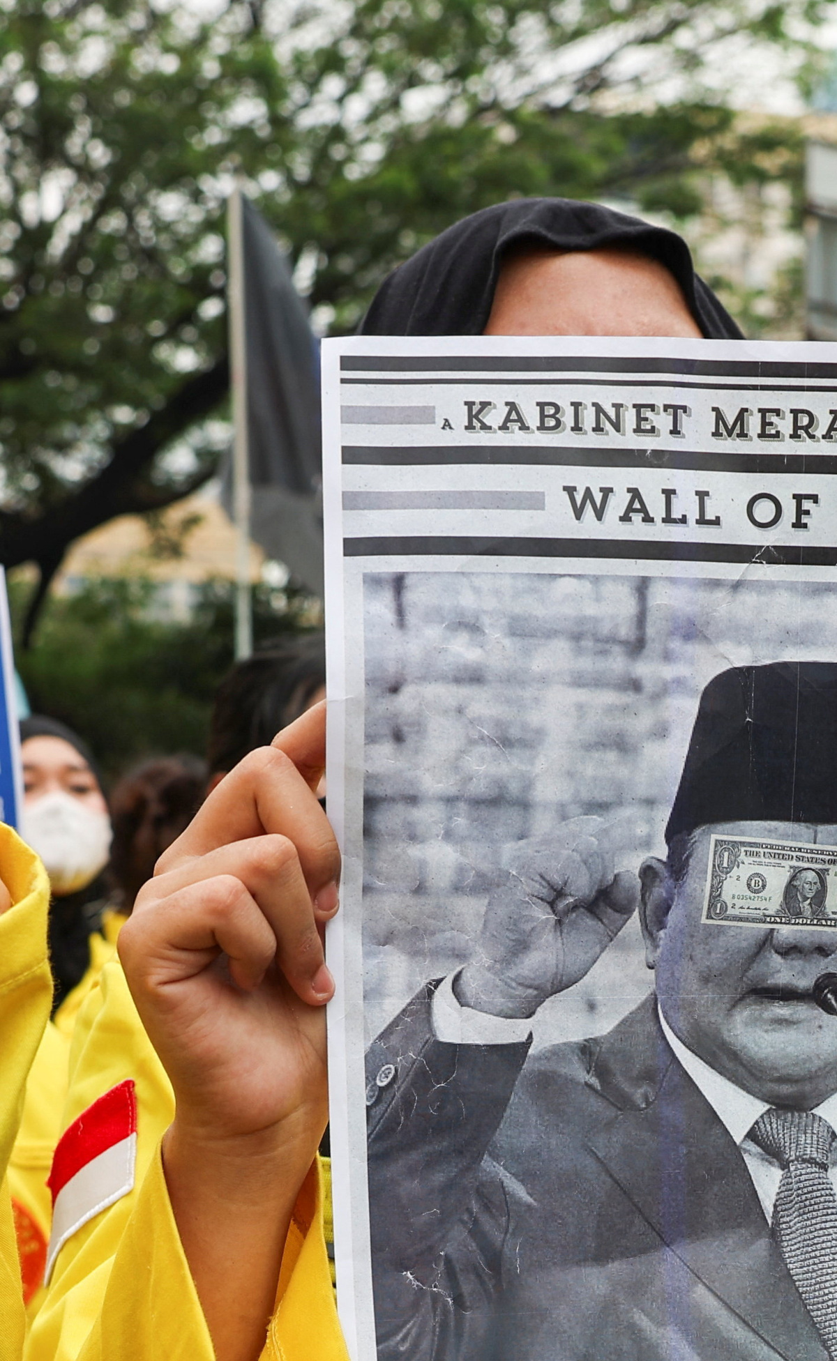 A student holds a poster depicting Indonesian President Prabowo Subianto during a protest against government policies, including state budget spending, fuel price hike, free meals programme, and expanded military roles in civilian affairs, in Jakarta, Indonesia, June 12, 2026. REUTERS/Ajeng Dinar Ulfiana