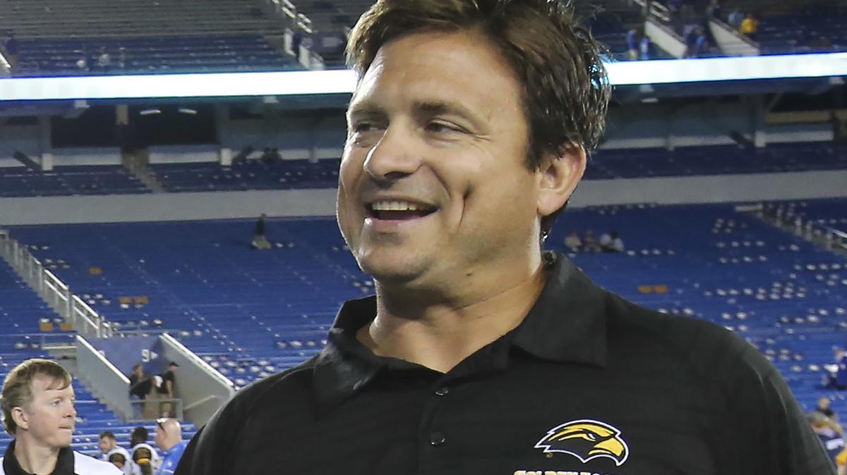 FILE - Southern Mississippi offensive coordinator Shannon Dawson smiles after they defeated Kentucky 44-35 in an NCAA college football game on Sept. 3, 2016, in Lexington, Ky. Miami is hiring Dawson to be its offensive coordinator, a person with knowledge of the decision told The Associated Press on Tuesday, Feb. 14, 2023. The person spoke on condition of anonymity because the deal was still being finalized and needed approval from the university. (AP Photo/David Stephenson, File)
