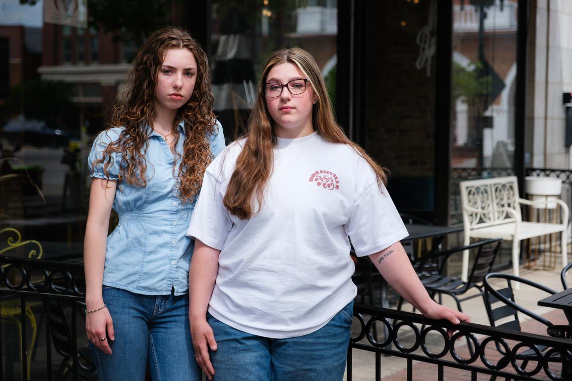 Emmelia Lorenzen, left, and Madison Shaffer, who were both raised in military families, in Fayetteville, N.C. on April 13, 2026. Lorenzen was particularly disturbed by Donald Trump's vow to 'annihilate the entire Iranian civilization'; Shaffer was upset at the prospect of another generation of young people heading to the Middle East to fight. " We're not thinking about what we're doing," she said. (Cornell Watson/The New York Times)