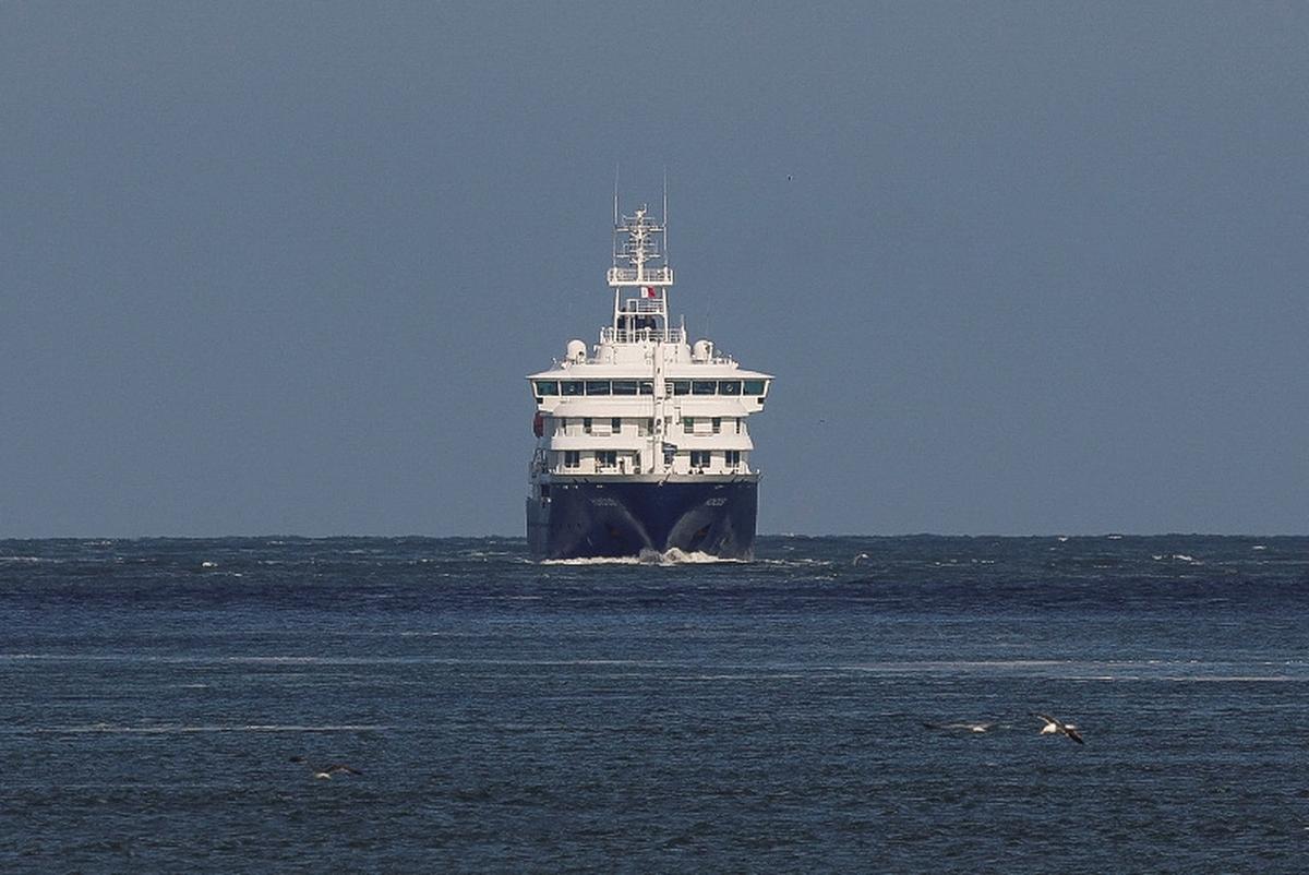The cruise ship MV Hondius, which was affected by a hantavirus outbreak, sails as it arrives for disinfection at the Port of Rotterdam, Netherlands, May 18, 2026. REUTERS/Yves Herman