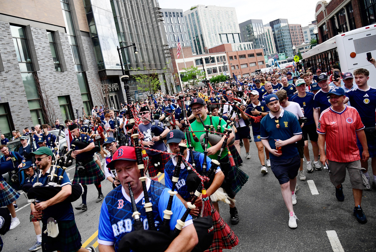 Soccer Football - FIFA World Cup 2026 - Scotland's Tartan Army march to Boston's Fenway Park baseball stadium - Boston, Massachusetts, U.S. - June 14, 2026 Scotland fans wearing kilts and playing the bagpipes during the march to Fenway Park IMAGN IMAGES via Reuters/Bob Dechiara