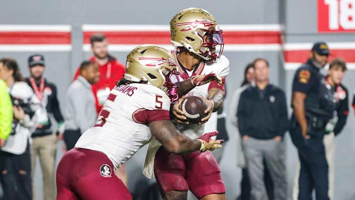  Nov 21, 2025; Raleigh, North Carolina, USA; Florida State Seminoles quarterback Tommy Castellanos (1) transfers the ball to running back Roydell Williams (5) during the second half of the game against NC State Wolfpack at Carter-Finley Stadium. Mandatory Credit: Jaylynn Nash-Imagn Images | Jaylynn Nash-Imagn Images 