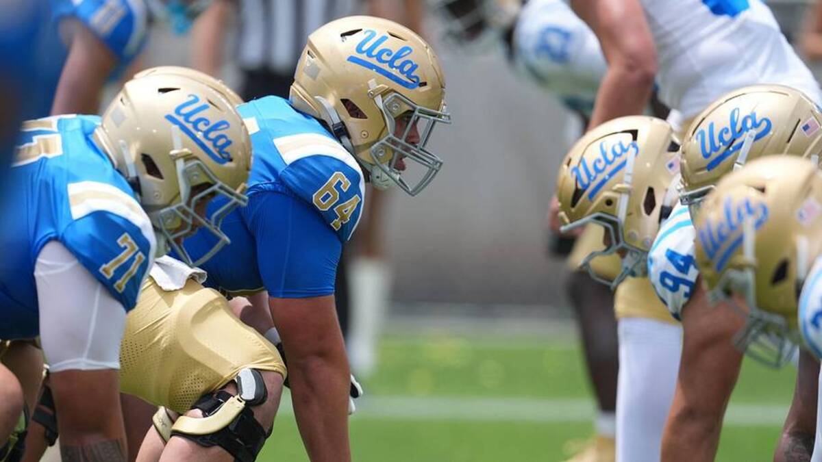  May 2, 2026; Pasadena, CA, USA; A general overall view of helmets at the line of scrimmage as UCLA Bruins center Sam Yoon (64) snaps the ball during the spring game at Rose Bowl. Mandatory Credit: Kirby Lee-Imagn Images | Kirby Lee-Imagn Images 
