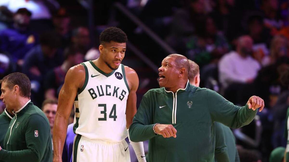  Feb 6, 2024; Phoenix, Arizona, USA; Milwaukee Bucks head coach Doc Rivers talks to forward Giannis Antetokounmpo (34) against the Phoenix Suns at Footprint Center. Mandatory Credit: Mark J. Rebilas-USA TODAY Sports | USA TODAY Sports via Reuters Connect 