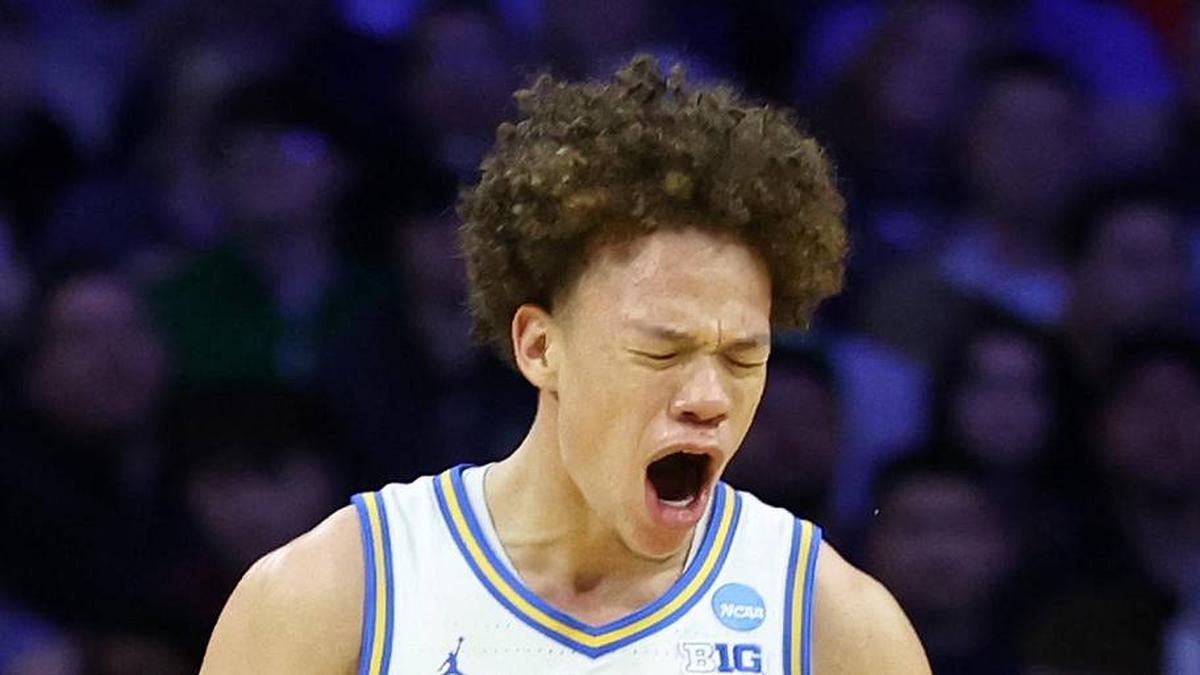  Mar 20, 2026; Philadelphia, PA, USA; UCLA Bruins guard Trent Perry (0) reacts with guard Eric Freeny (8) in the second half during a first round game of the men's 2026 NCAA Tournament at Xfinity Mobile Arena. Mandatory Credit: Bill Streicher-Imagn Images | Bill Streicher-Imagn Images 