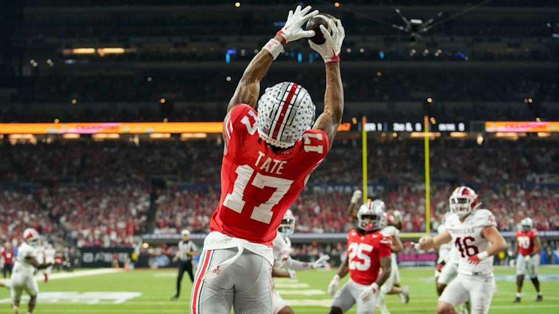 Ohio State Buckeyes wide receiver Carnell Tate (17) makes a catch for a touchdown Saturday, Dec. 6, 2025, during the Big Ten football championship against the Indiana Hoosiers at Lucas Oil Stadium in Indianapolis. 