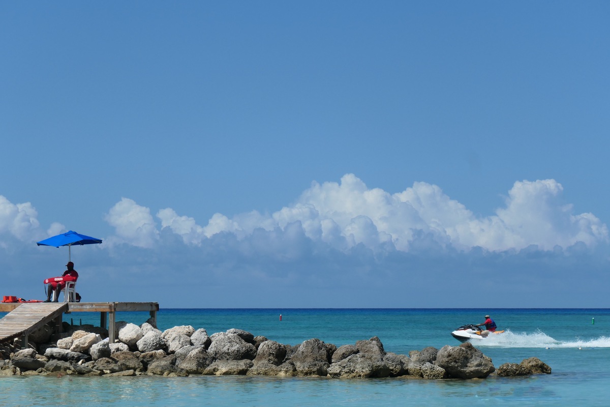  Jet skiing is a popular water sport along the beaches of the Grand Bahama Islands. As seen here, on May 9, 2019, a lifeguard keeps a watchful eye from a rock jetty as a jet skier passes by. 