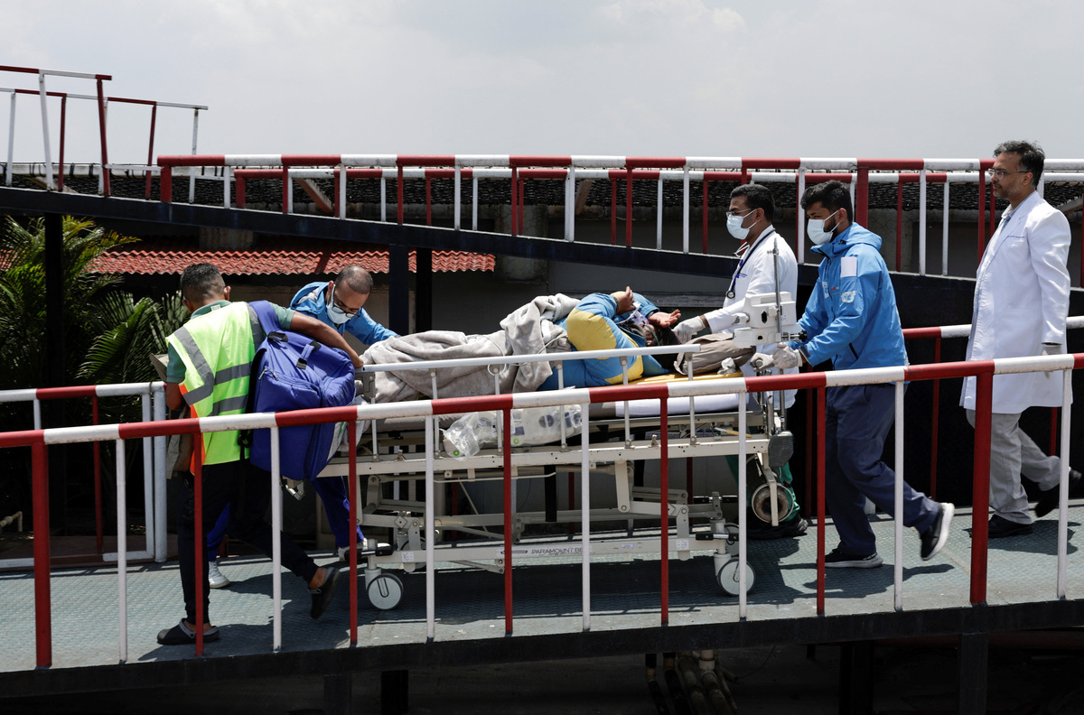 Paramedics transport Dawa Sherpa, who was missing for several days in the Everest region, from the helipad at HAMS Hospital in Kathmandu, Nepal, June 4, 2026. REUTERS/Navesh Chitrakar