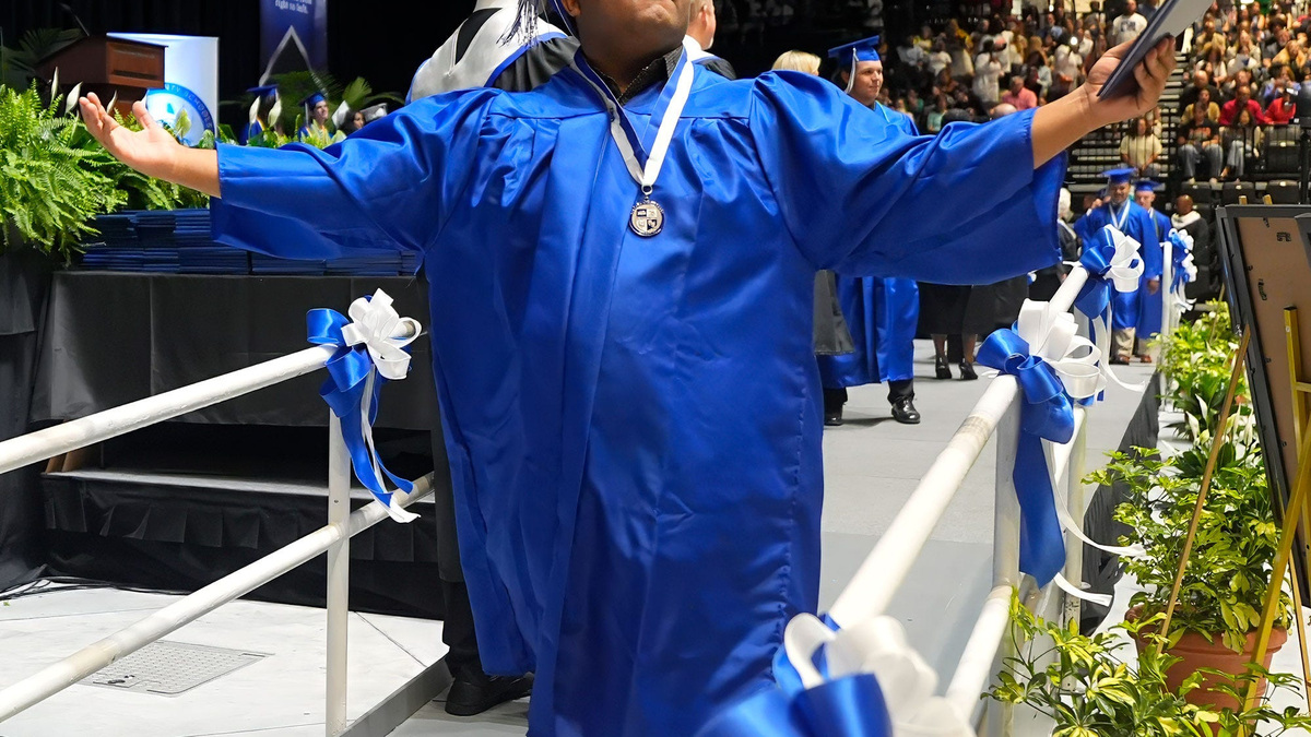 A 2026 Deltona High School graduate walks the stage at the Ocean Center after earning a diploma. Volusia County Schools earned back-to-back A grades from the Florida Department of Education for the first time in 2026.
