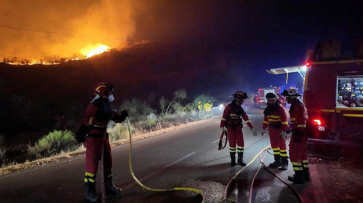 Firefighters work to control a wildfire in Almeria, Spain in this screen grab from handout video released July 11, 2026.     Spanish Military Emergency Unit/Handout via REUTERS