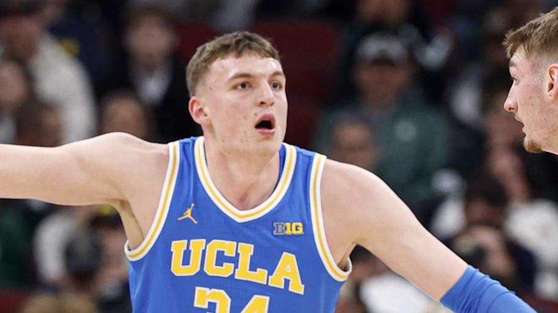  Mar 13, 2026; Chicago, IL, USA; UCLA Bruins forward Tyler Bilodeau (34) defends against Michigan State Spartans center Carson Cooper (15) during the first half at United Center. Mandatory Credit: Kamil Krzaczynski-Imagn Images | Kamil Krzaczynski-Imagn Images 