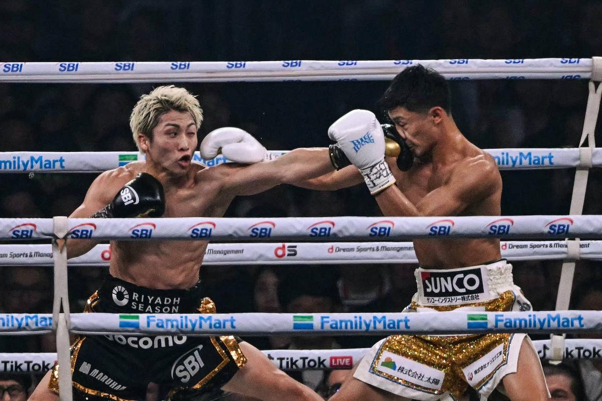  Naoya Inoue (L) fights Junto Nakatani during their super bantamweight championship boxing contest. Yuichi YAMAZAKI / AFP via Getty Images