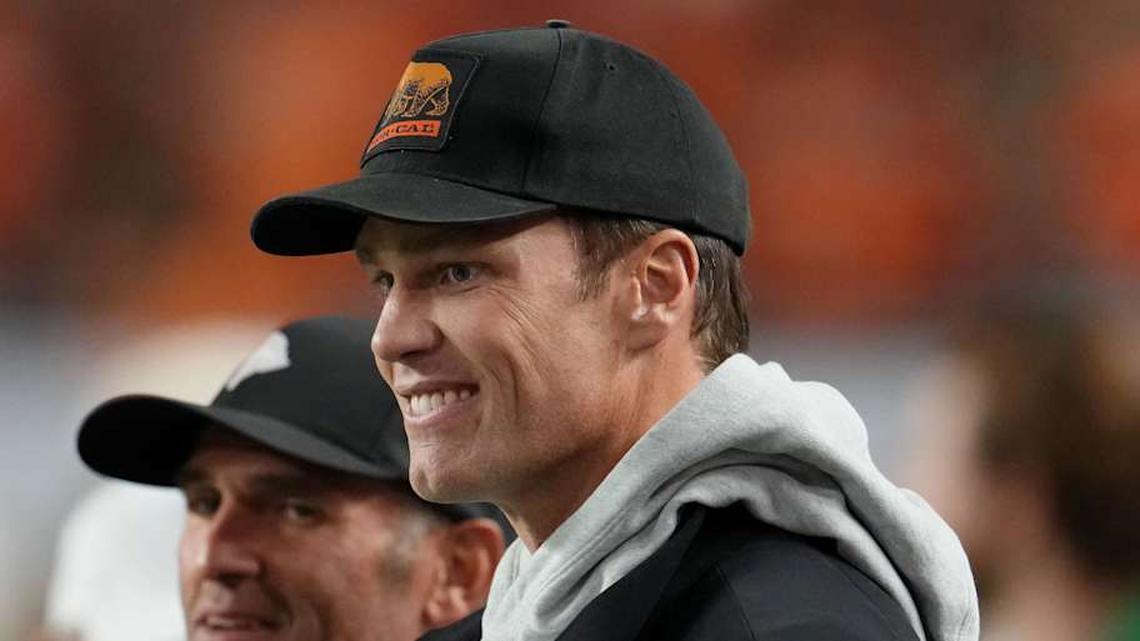  Jan 19, 2026; Miami Gardens, FL, USA; Tom Brady looks on from the sideline before the CFP National Championship college football game between the Indiana Hoosiers and the Miami Hurricanes at Hard Rock Stadium. Mandatory Credit: Kirby Lee-Imagn Images | Kirby Lee-Imagn Images 