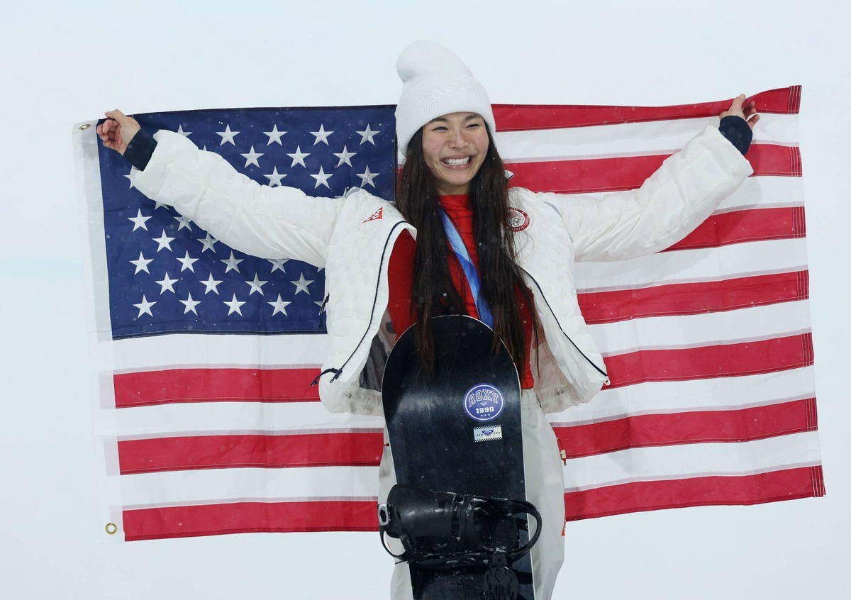  Feb 12, 2026; Livigno, Italy; Chloe Kim of the United States celebrates her silver medal in the women's halfpipe final during the Milano Cortina 2026 Olympic Winter Games at Livigno Snow Park. Mandatory Credit: Nathan Ray Seebeck-Imagn Images 