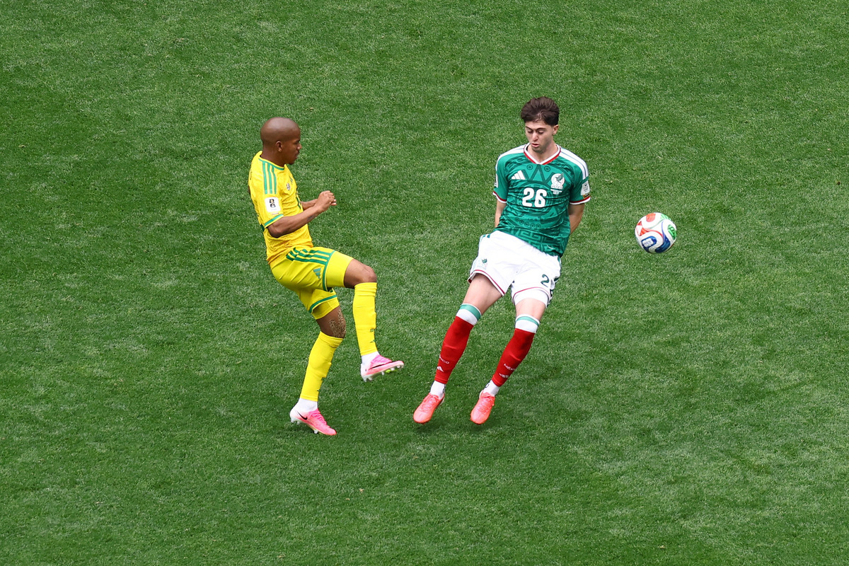 Soccer Football - FIFA World Cup 2026 - Group A - Mexico v South Africa - Estadio Azteca, Mexico City, Mexico - June 11, 2026 Mexico's Brian Gutierrez in action with South Africa's Jayden Adams REUTERS/Raquel Cunha