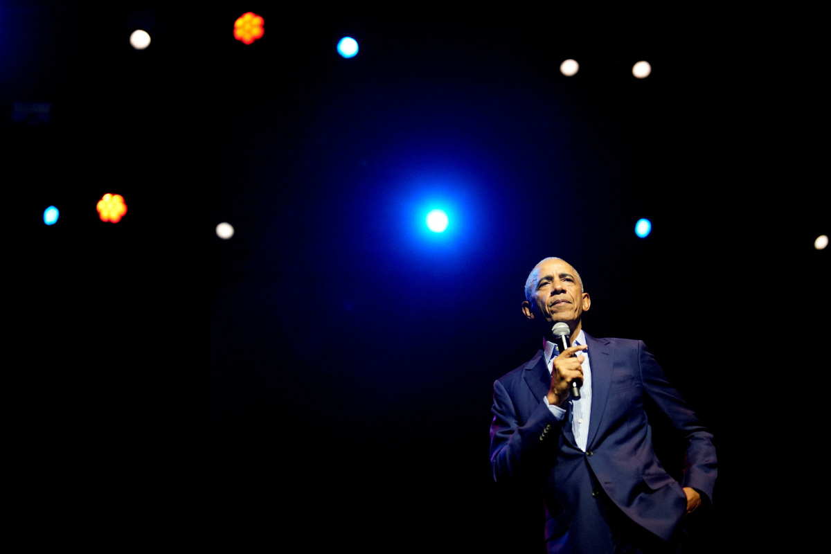 Former President Barack Obama speaking on stage as he surprised administration and campaign alumni in Chicago ahead of the dedication ceremony of the Obama Presidential Center, Wednesday, June 17, 2026.     Pablo Martinez Monsivais/Pool via REUTERS