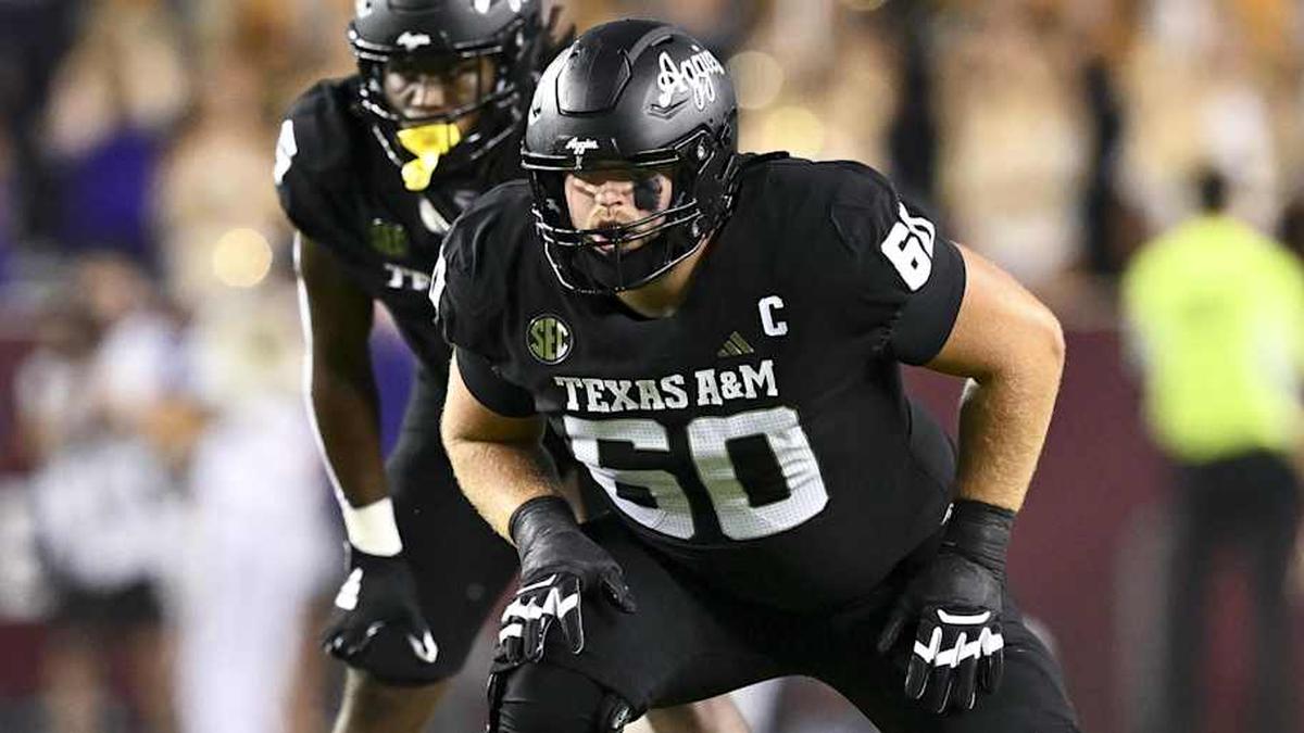  Oct 26, 2024; College Station, Texas, USA; Texas A&M Aggies offensive lineman Trey Zuhn III (60) lines up during the second quarter against the LSU Tigers. The Aggies defeated the Tigers 38-23; at Kyle Field. Mandatory Credit: Maria Lysaker-Imagn Images. | Maria Lysaker-Imagn Images 