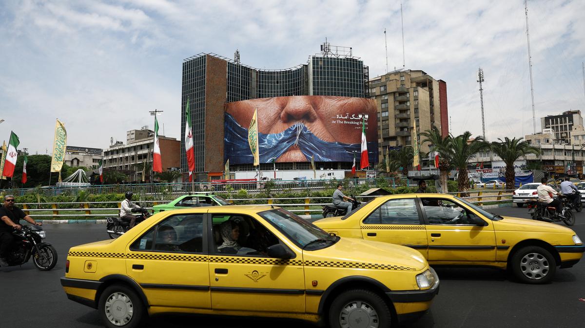 People drive past an anti-U.S. billboard depicting U.S. President Donald Trump and the Strait of Hormuz, in Tehran, Iran, May 2, 2026. Majid Asgaripour/WANA (West Asia News Agency) via REUTERS