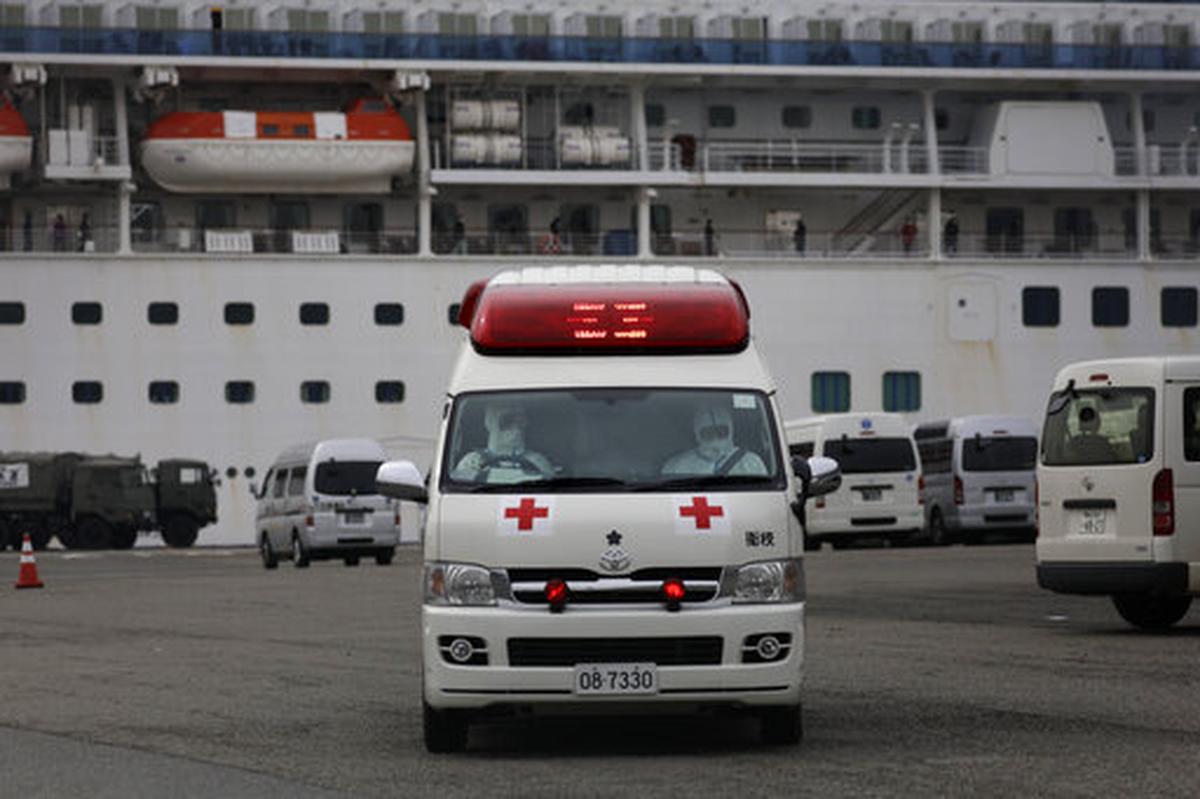 Medical workers wearing protective suits leave after tending to passengers on the quarantined Diamond Princess cruise ship Saturday, Feb. 15, 2020, in Yokohama, near Tokyo. A viral outbreak that began in China has infected more than 67,000 people globally. The World Health Organization has named the illness COVID-19, referring to its origin late last year and the coronavirus that causes it.