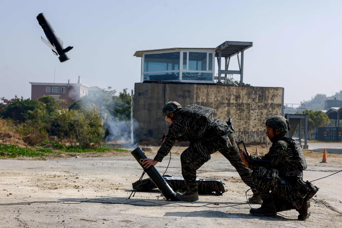 FILE PHOTO: Soldiers operate a Taiwan-made attack drone during an annual military exercise ahead of the Lunar New Year, in Kaohsiung, Taiwan, January 29, 2026. REUTERS/Ann Wang/File Photo