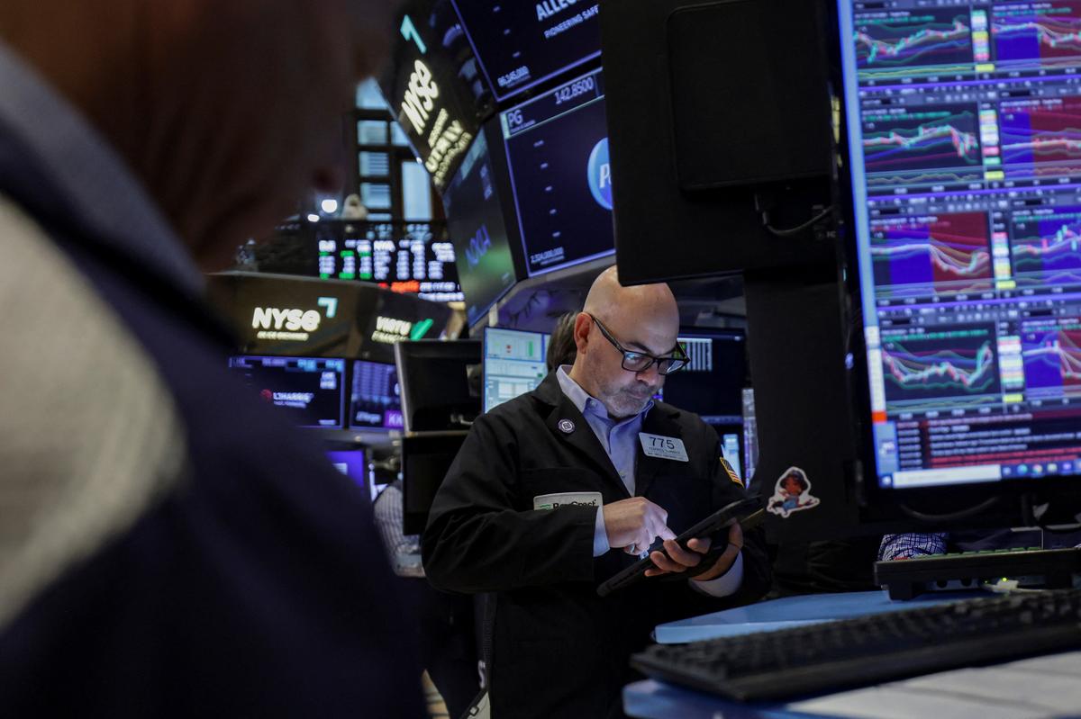 A trader works on the floor at the New York Stock Exchange (NYSE) in New York City, U.S., April 23, 2026. REUTERS/Jeenah Moon