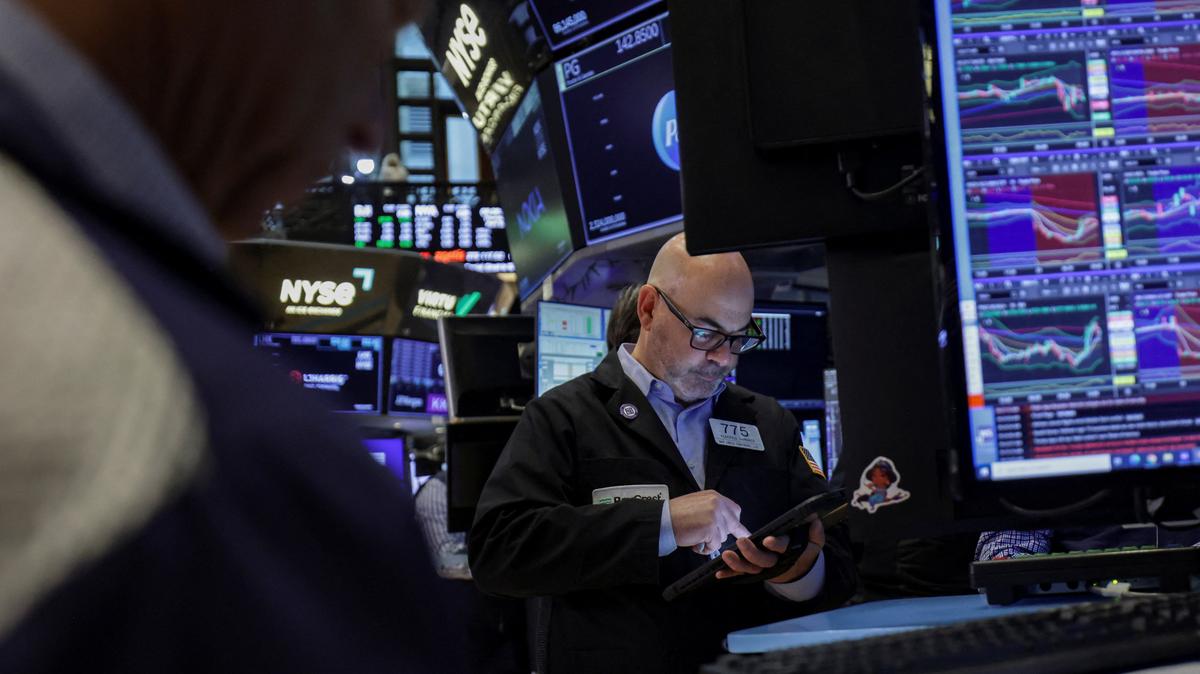 A trader works on the floor at the New York Stock Exchange (NYSE) in New York City, U.S., April 23, 2026. REUTERS/Jeenah Moon